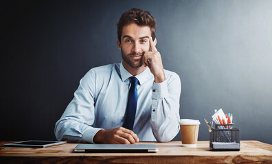 Businessman, portrait and corporate at desk with wall background as insurance broker, confidence or investment. Male person, face and stationery at table or mockup space or about us, startup or loan