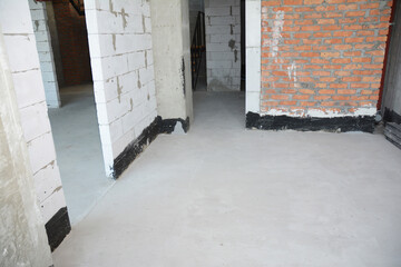 Close up on concrete floor and waterproofing indoor house walls
