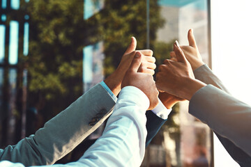 Diversity, business and hands of team thumbs up in office building for unity with support, trust...