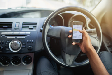 Phone, texting and driving with hands of person on steering wheel with scroll, danger and risk. Road safety, awareness and driver in car with smartphone, distraction and attention with auto insurance - obrazy, fototapety, plakaty