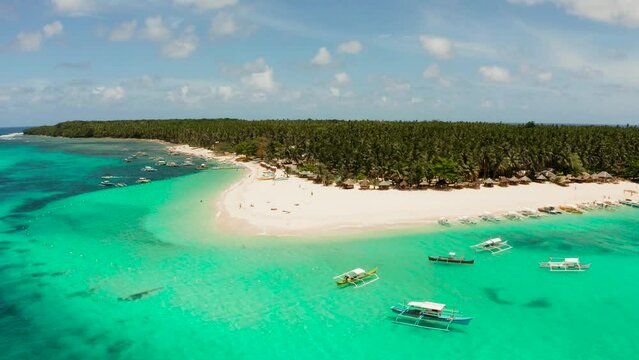 Travel concept: sandy beach on a tropical island by coral reef atoll from above. Daco island, Philippines. Summer and travel vacation concept