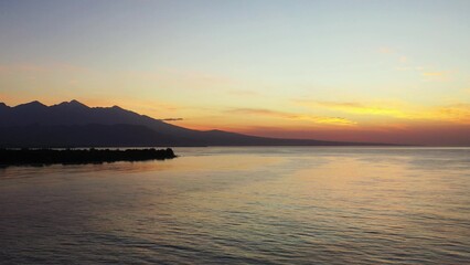 Fototapeta na wymiar Beautiful view of an island with a calm sea during sunset