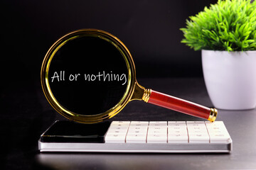 text ALL OR NOTHING through a magnifying glass on a black background with green grass in the...