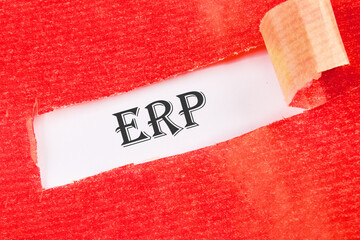 Abbreviation ERP - Enterprise Resource Planning on a white background under torn paper