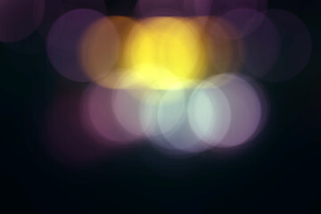 Blurred image of purple and yellow Christmas lights