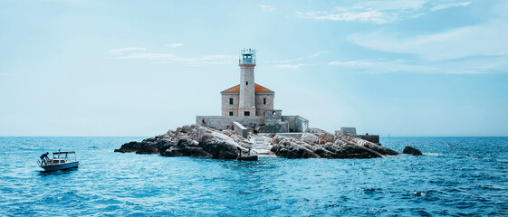 Panoramic view of a beautiful lighthouse in the mediterranean sea of Croatia in a sunny day during...