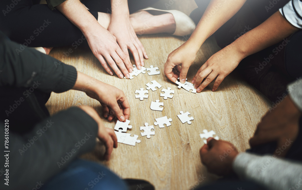 Poster People, support and hands with puzzle on table for problem solving, interaction and teamwork in integration. Diversity, team and training with jigsaw for creative strategy, collaboration and learning