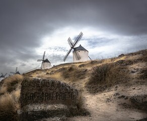 Mills in Consuegra, Castilla La Mancha, Spain under the cloudy gloomy sky