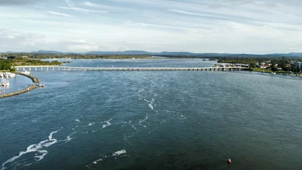 Fotobehang Drone shot of Wallis Lake, Forster on a sunny day © Wirestock