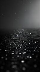 Rain water droplets on a black background