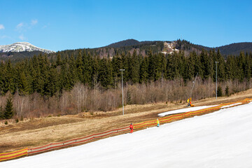 ski slope on a sunny day with a ski lift. active holiday with family