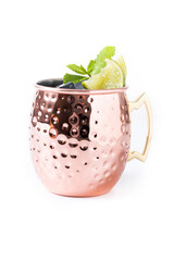 Moscow mule cocktail served with ice and slice of lime isolated on white background