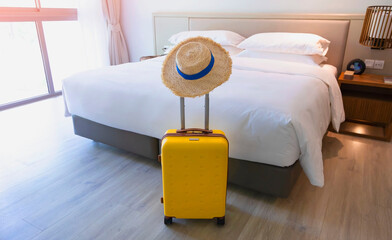 The travel with a colors luggage as business trip in a Holiday image of city building background, journey holiday concept