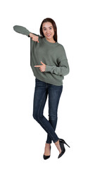 Smiling woman in casual clothing pointing to her left, isolated on a white background, concept of direction - 786124623