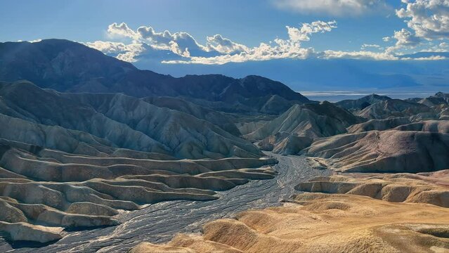 Zabriskie Point Erosion Landscape, Dramatic erosional landscape at Zabriskie Point in Death Valley under a cloudy sky.