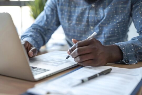 Man filling out workers compensation claim after being injured.