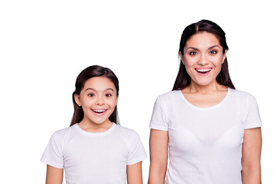 Close up photo pretty two people brown haired mum small little daughter eyes mouth opened facial expression delighted sale discount wearing white t-shirts isolated bright blue background