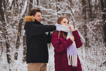 Beautiful young teen couple spending time together outside in cold winter