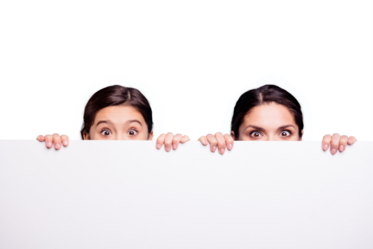 Close up photo pretty two people brown haired mum little daughter wondered eyes above  showing blank signboard fingers arms holding wearing white t-shirts isolated bright blue background - Powered by Adobe
