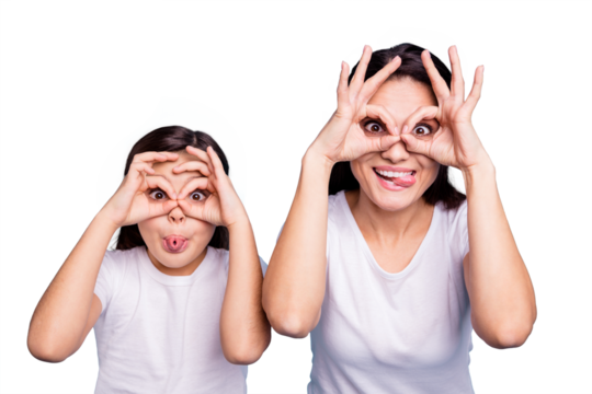 Close up photo beautiful two people brown haired mom little daughter friends look finger specs okey symbol tongue out mouth silly shapes figures wear white t-shirts isolated bright blue background
