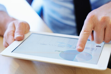 Businessman, hands and tablet at desk for data analysis, payroll and e-commerce in workplace. Digital notebook, trader and research in corporate office for investment, startup and finance management