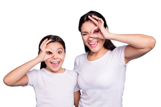 Close up photo beautiful two people brown haired mom little daughter friends look finger specs okey symbol silly screaming shouting wear white t-shirts isolated bright blue background