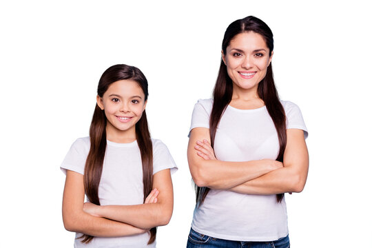 Close up photo pretty two people brown haired mum small little daughter crossed arms self-confidently standing ready win winner family competitions wear white t-shirts isolated bright blue background