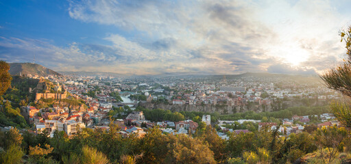 Panorama landscape of old Tbilisi on the background of beautiful cloudy sky - obrazy, fototapety, plakaty