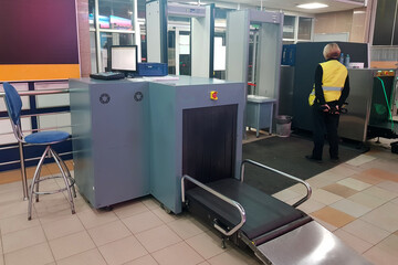 Security checkpoint with scanner machines are scanning luggages. transportation and security technology concept