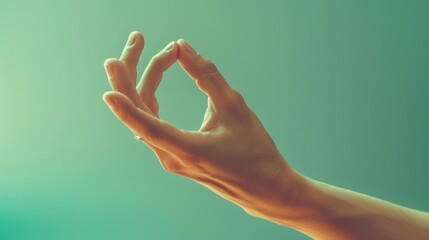 A yoga hand gesture in the Brahma mudra. Isolated on a toned background. - obrazy, fototapety, plakaty
