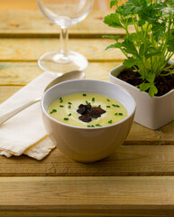 Homemade asparagus soup, seasoned with chives and black truffle...