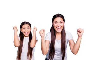 Close up photo cheer two people brown haired mum small little daughter hands arms air glad yell...
