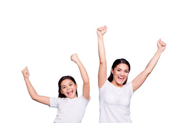 Close up photo cheer two people brown haired mum small little daughter hands arms air glad yell...