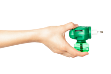 Woman's hand holding a green plug