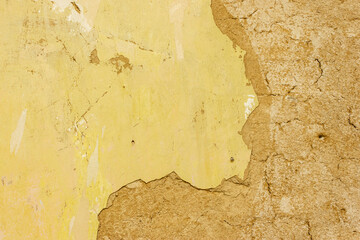 Peeling yellow paint on wall.