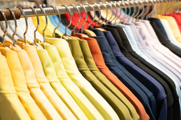 Selective focus, Fashion , clothes concept ,Clothes or pants many colors hang on a shelf in a...