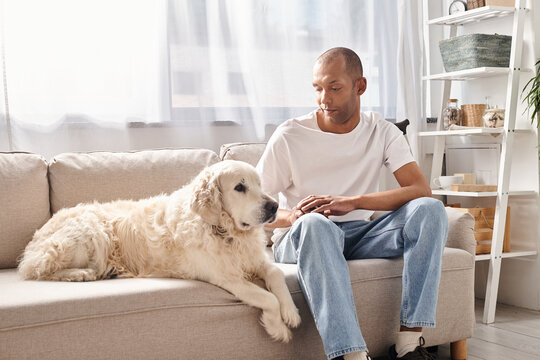 Myasthenia gravis patient and Labrador dog share a peaceful moment on the couch, embodying diversity and inclusion.