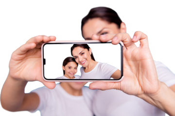 Close-up portrait of two nice people wearing casual white t-shirt holding in hands device making taking selfie photo screen isolated over blue pastel background