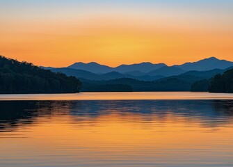 Fototapeta na wymiar Sunset Over Lake With Mountains