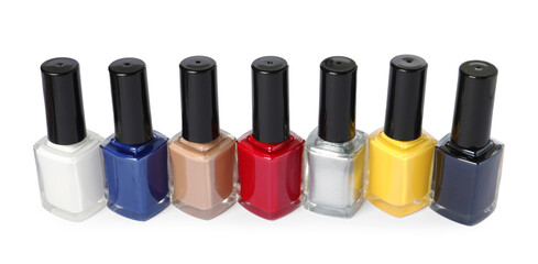 Obraz premium Bright nail polishes in bottles isolated on white
