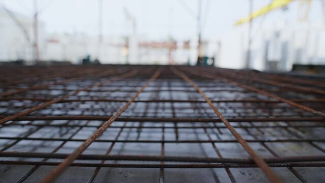 Rebar texture. Rusty rebar for concrete pouring. Steel reinforcement bars. Construction rebar steel work reinforcement. Steel rebars. A pile of construction metal fittings on a construction site.
