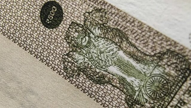 Five hundred rupee indian currency bank note signs and symbols stop motion extreme closeup macro flat lay top view. India inflation, tax, reserve money, economy, banking and investment concept.