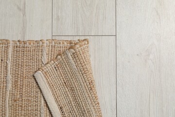 Soft carpet with pattern on white laminated floor indoors, top view. Space for text