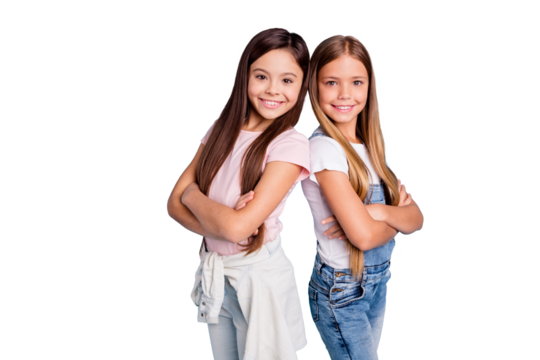 Portrait of nice-looking cute lovely sweet well-groomed attractive cheerful cheery straight-haired girls standing back to back siblings folded arms isolated over blue pastel background