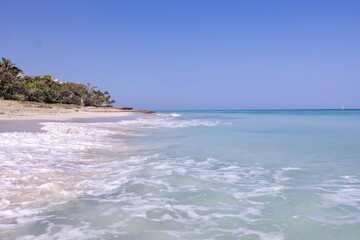 The beautiful beach front of the Cuban beach at Varadero in Cuba showing the waves and clean ocean...