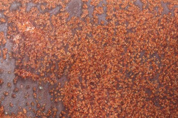 Closeup of metal wall that is aged and rusted, background texture.