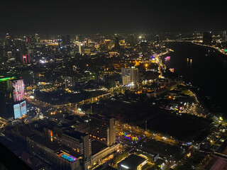 Skyline of Phnom Penh at night with beautiful lights with a tall aerial view of skyscrapers in...