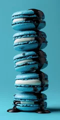 Zelfklevend Fotobehang stack of blue macarons isolated on blue background  © Clemency