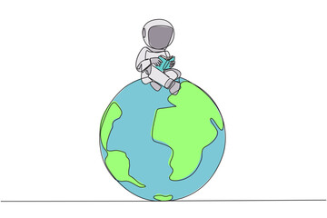 Single continuous line drawing astronaut sitting on big globe reading a book. The metaphor of reading can reach the world. Read everywhere. Book festival concept. One line design vector illustration