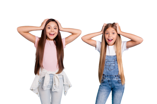 Portrait of two people nice cute amazed attractive charming cheerful funny straight-haired pre-teen girls touching head great news wow cool isolated over blue pastel background